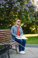 blind man sitting on a bench