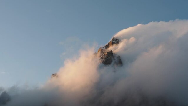Evening clouds on the top of south Ushba, one of the most notable peak of the Caucasus Mountains, Georgia.