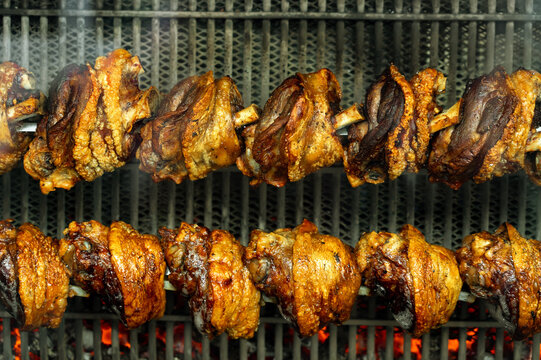 pork hocks schweine haxen stelzen roasting on the grill in Munich