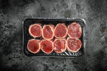 medallion steaks wrapped in bacon, Raw fresh marbled meat Steak filet mignon. Culinary, cooking concept. top view. place for text