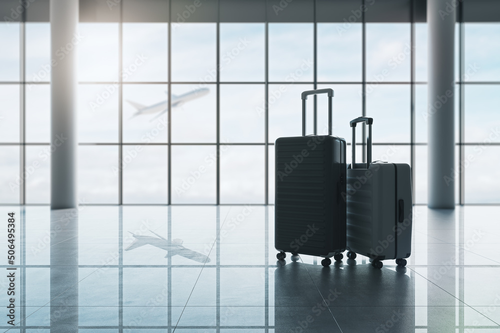 Poster travel and vacation concept with hand luggage suitcase and big one on glossy empty airport building 