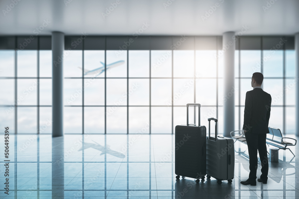 Poster busines travel and communication concept with businessman with two suitcases in empty waiting area a