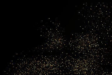 Gold glitter texture on black background. Golden grainy abstract texture on a black background. Design element.