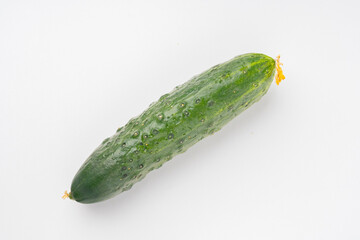 fresh green cucumber with pimples on a white background, the concept of healthy food and non-gmo products, selective focusing, macro photos from different angles, reflection on white