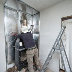 mounting on the walls of metal profile and mineral wool for thermal protection for walls.