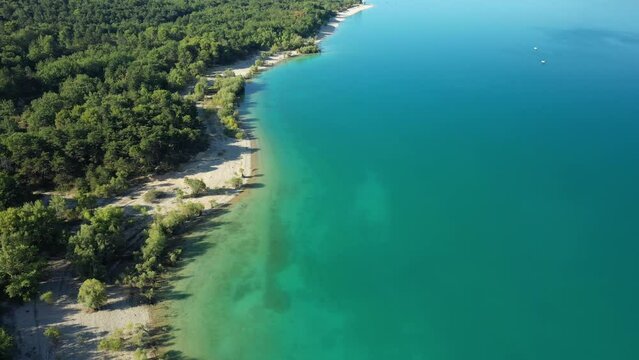 The paradisiacal colors of Lake Sainte-Croix and its green forests in Europe, France, Provence Alpes Cote dAzur, in the Var, in summer, on a sunny day.