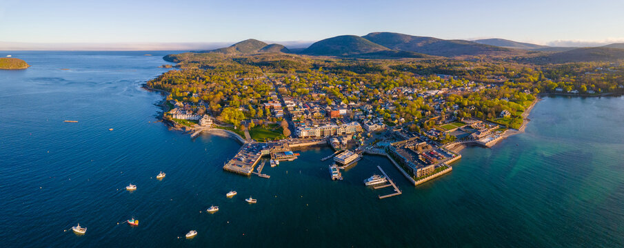 Bar Harbor historic town center panorama aerial view at sunset, with Cadillac Mountain in Acadia National Park at the background, Bar Harbor, Maine ME, USA. 