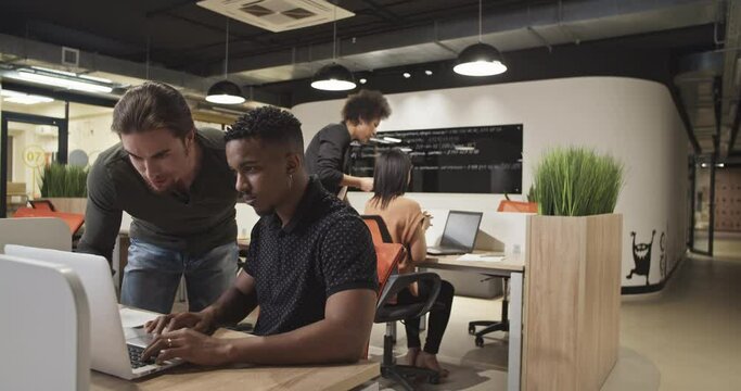 Diverse colleagues collaborating in office