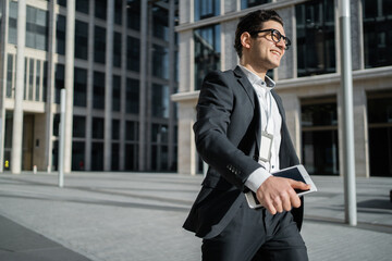 A financier a banker a man in glasses and a formal suit a businessman goes to work in the office