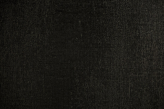 Dark background of decorative plaster with abstract spots. Unusual black or gray wall texture with beautiful patterns, creative surface background. Finishing coating for building cladding. © Vera