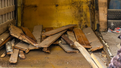 Removal of construction debris. Loading the garbage can waste construction trash dumpsters on house renovation.