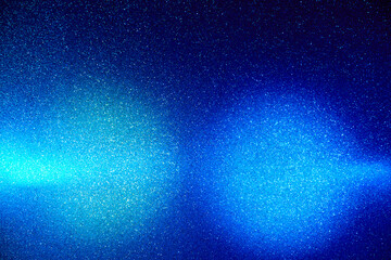 On a gradient blue background in fine grain clouds of light blue and light purple light