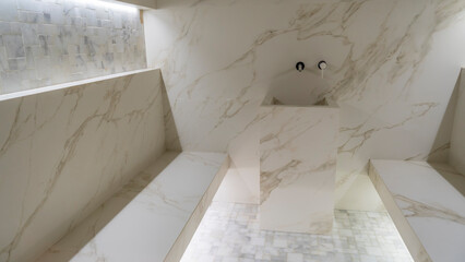 Classic turkish hammam. White turkish bath with marble surfaces. Marble oriental bathroom. Steam bath interior. - obrazy, fototapety, plakaty