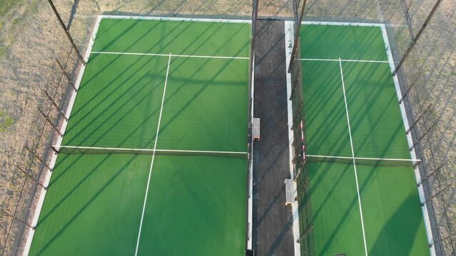 Padle court outside double and single court a sunny afternoon
