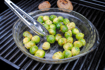 Whole Fresh Brussell Sprouts Sautéing on a Hot Summer Grill