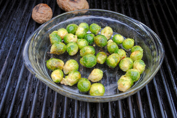 Whole Fresh Brussell Sprouts Sautéing on a Hot Summer Grill