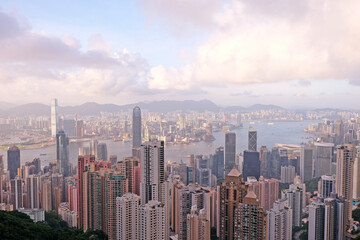 Panorama of Hong Kong business district in a foggy day. Beautiful sunset over the Victoria bay in Hong Kong.