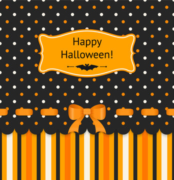 Halloween card with bow on polka dots background.