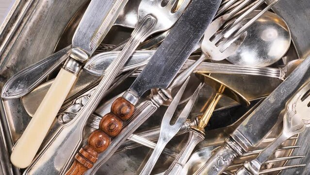 Silver old crockery on old background