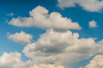 White clouds against blue sky. Daylight, cloudy day. Nature, freedom and peaceful concept