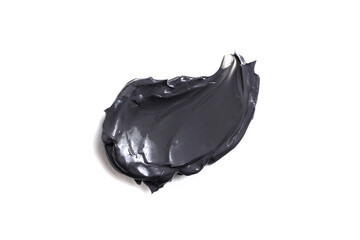 Charcoal face mask or black scrub stroke isolated on white bacground.