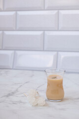 Traditional indian and middle eastern hot drink masala tea or karak chai with spice and milk and crystal sugar. Exotic cuisine.