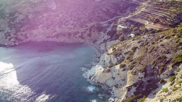 Hidden beach surrounded by mountainous coast