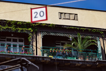Balconies with plants in tall townhouse