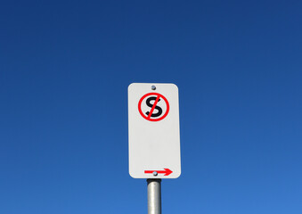 no standing sign against blue sky