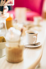 Cup of aromatic coffee at spa salon 