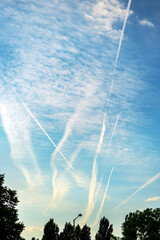 Airplane contrail or vapor trail pattern on blue sky