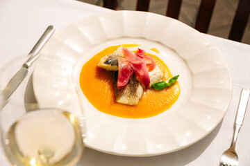 Sea bass steak in yellow stew in Venice
