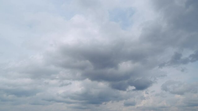 Clear blue sky with some white fluffy clouds. Natural heaven backdrop.