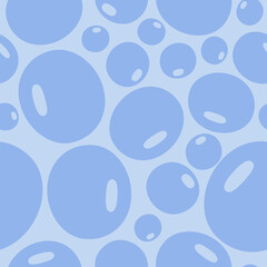 Seamless pattern with blue bubbles of different sizes on a light background
