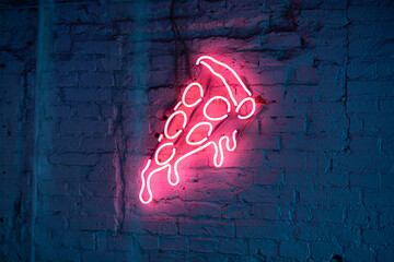 graffiti on wall with neon pizza logo - Powered by Adobe