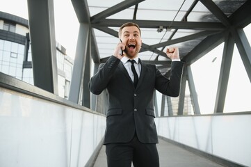 Portrait of a smiling businessman in a modern business environment