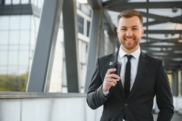 Fototapeta premium Portrait of an handsome businessman in an urban setting