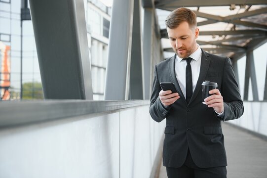 Portrait of an handsome businessman in an urban setting
