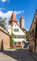 Dinkelsbühl, Germany. Beautiful view of Kapuzinerweg street with castle towers