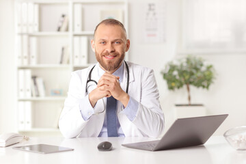 Male general practitioner sitting in an office