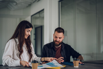 Two business colleagues having a meeting in the open space office