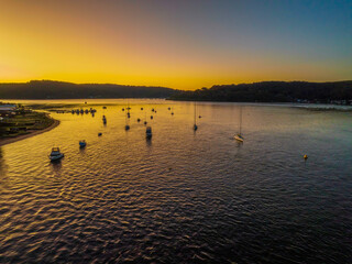Fototapeta premium Aerial sunrise waterscape with clear skies