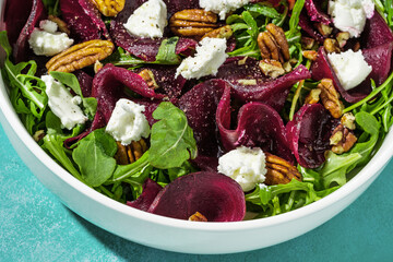 salad with beets, arugula and farm sheep's cheese with nuts and balsamic sauce. summer recipe