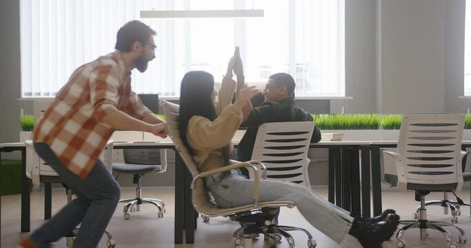 Cheerful employees have fun during break at workplace
