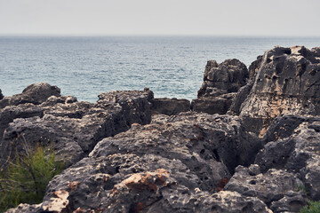Fototapeta na wymiar Atlantic ocean landscape in Cascais, Portugal. Rocky oceanview