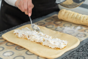 girl adding stuffing to the pie
