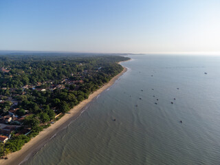 Charming seaside town with the look of a fishing village in the middle of the Atlantic Forest - Cumuruxatiba, Bahia, Brazil - aerial drone view of the beach