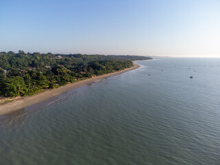 Charming seaside town with the look of a fishing village in the middle of the Atlantic Forest - Cumuruxatiba, Bahia, Brazil - aerial drone view of the beach