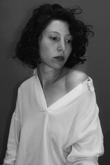 
black and white studio portrait of young woman with short brunette hai