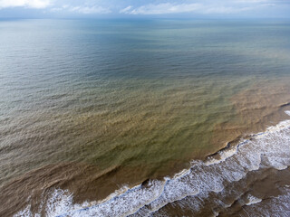 Atlantic Ocean at low tide with many rocks and sea rocks. Drone top view. Atlantic Ocean, Bahia, Brazil